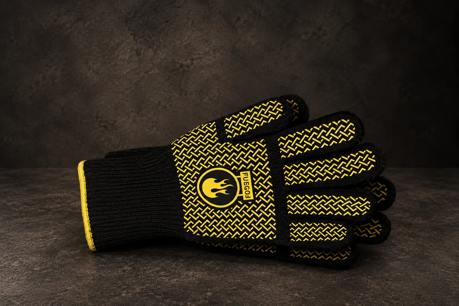 The heat resistant grill gloves, on dark stone