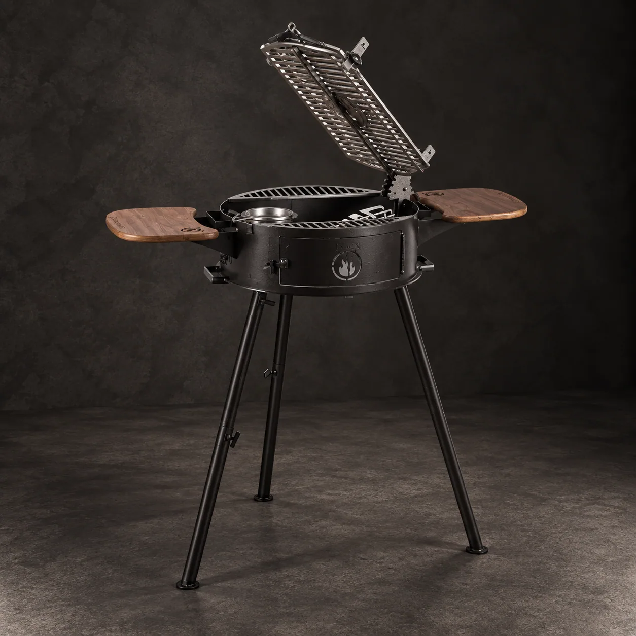 The Ivar Pro 2.0 portable grill, on dark stone